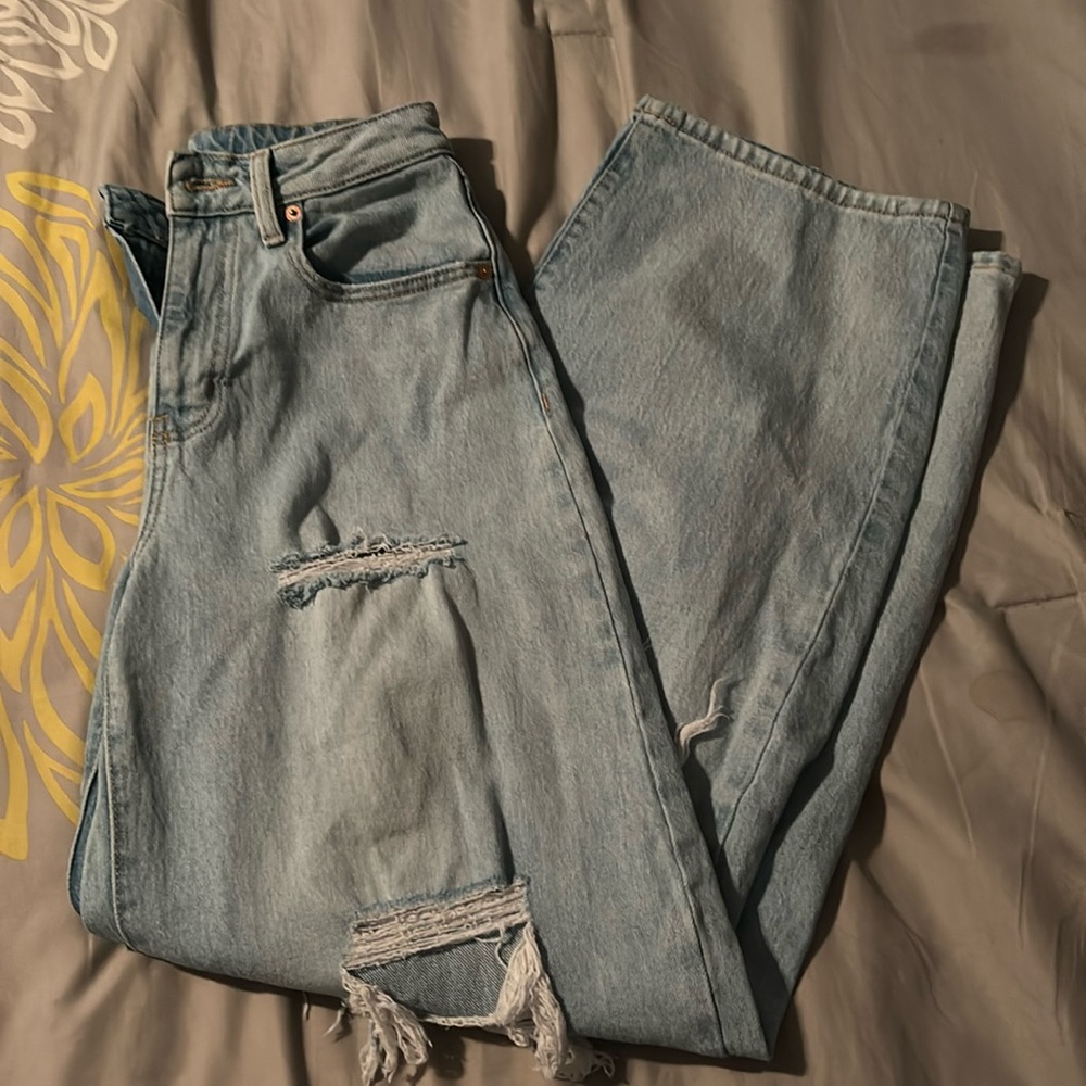 light blue ripped baggy jeans